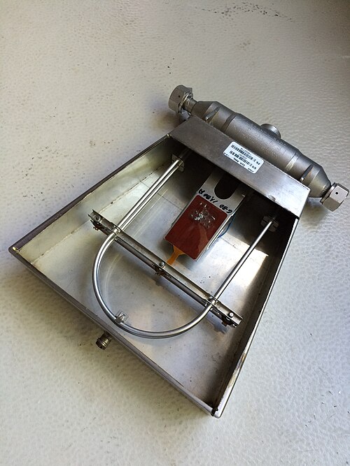 A Coriolis mass flow meter with the characteristic U-shaped tube housing