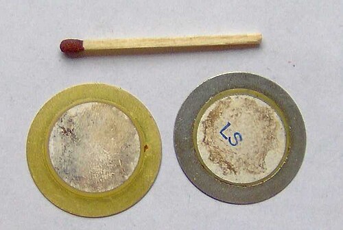 Piezoelectric metal disc — same element used in buzzers and contact sensors