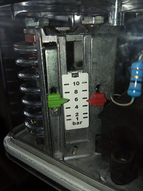 A mechanical pressure switch — typical diaphragm-style enclosure with adjustable setpoint