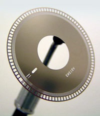 A glass code wheel — the slotted disc inside a high-resolution optical encoder